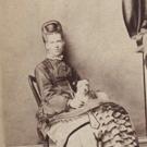 Unidentified sitter with dog